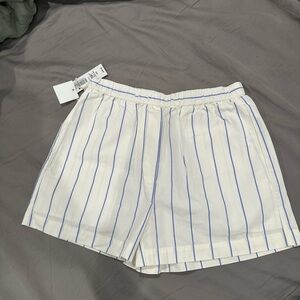 White Shorts with Blue Stripes
